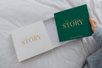 CheriBOO Baby Memory Book in Evergreen sliding out of its keepsake box