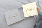 CheriBOO Baby Memory Book in Natural (warm cream) sliding out of its keepsake box