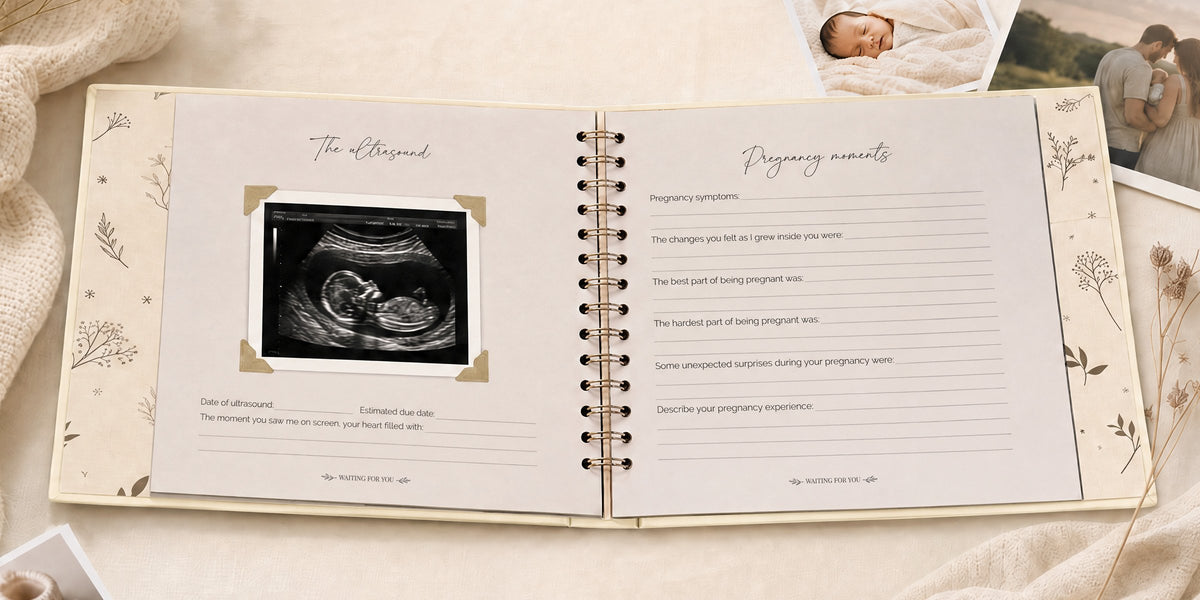 The CheriBOO Baby Memory Book in Natural open on the ultrasound page, with printed photos beside it